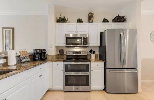 Caloosahatchee Condo | Beautifully Designer Inspired Condo with Park-Like Setting in Banyan Trace