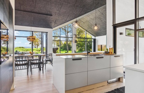 Hojslev House | Beautifully situated house on a natural plot with magnificent fjord views.