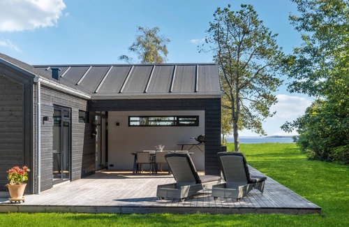 Hojslev House | Beautifully situated house on a natural plot with magnificent fjord views.