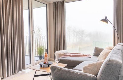 Marienleuchte Apartment | BeltBlick 3 - Moderne Ferienwohnung direkt an der Ostsee mit Meerblick und Sauna!
