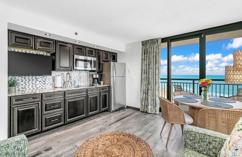 Windy Hill Condo | Best view at Beach Cove- Tropical oceanfront corner condo with double balcony!