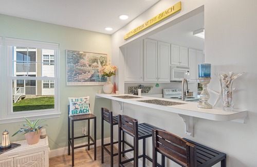 Ocean View Condo | Bethany Bay condo with pool, fireplace, screened porch & AC