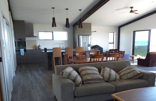 Waiotahi House | Big Black Beachfront Bach in family friendly community.