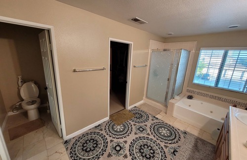 Eastvale House | Big Master bedroom with own bathroom toilet and wardrobe