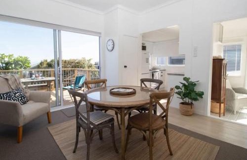 Rewa House | Blue Water Cottage - with beachfront coastal views
