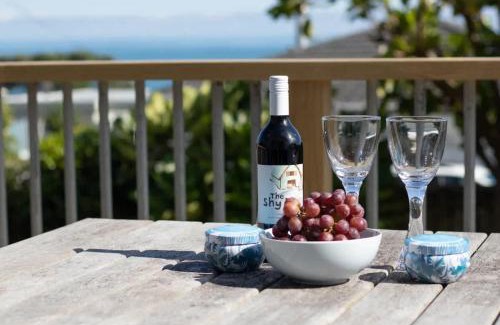 Rewa House | Blue Water Cottage - with beachfront coastal views