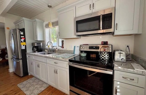 East Falmouth House | BRAND NEW LISTING! 2BD Pond Front Home-A/C, Sun Room, Enclosed Outdoor Shower, Wonderful Water Views