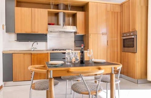 Ponte San Giovanni Apartment | Bright 80 sqm apartment that can accommodate up to 6 people, located near the Ponte San Giovanni station. It consists of a living room with kitchen and dining area, a bathroom and two bedrooms. The flat is located on the ninth floor and has a large terra