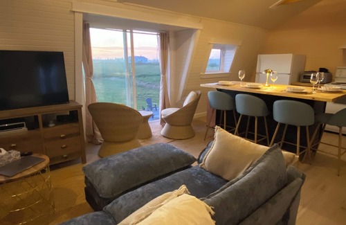 Cape Saint Marys Apartment | Bright and Airy Ocean View Loft. A few minutes walk to Mavillette beach.