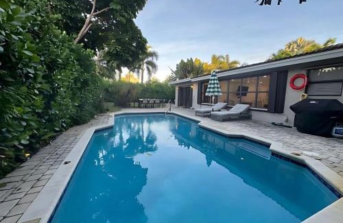 South Corals Villa | Bright Fort Lauderdale Villa with Private Heated Pool, Modern Décor and Palm-Lined Outdoor Oasis