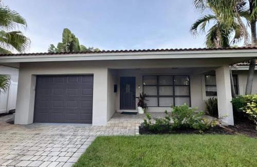 South Corals Villa | Bright Fort Lauderdale Villa with Private Heated Pool, Modern Décor and Palm-Lined Outdoor Oasis