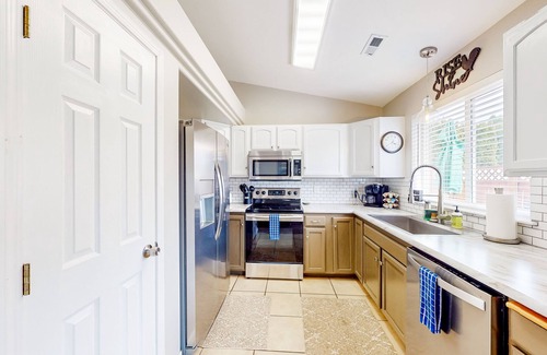 Coeur d'Alene House | Bright home with fenced yard & furnished patio for alfresco living