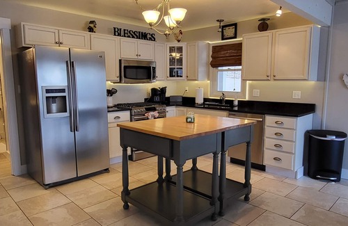 Sunrise Beach House | Bring your boat or jetskis and launch on site! Wood burning fireplace!
