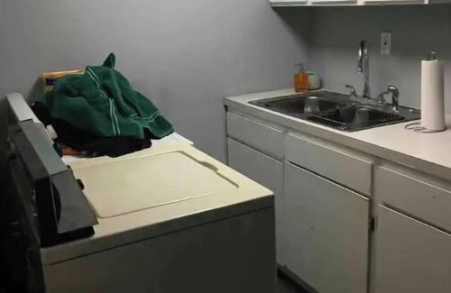 Spokane House | Bungalow with hidden room behind bookcase door and no cleaning fees