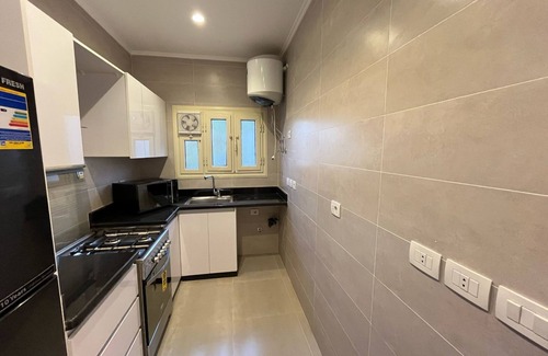Taqseem Laselky Apartment | By Regypt Studio Roof With Shared Terrace.