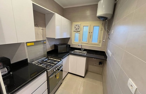 Taqseem Laselky Apartment | By Regypt Studio Roof With Shared Terrace.