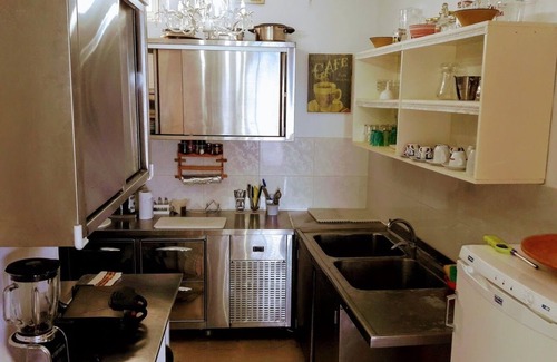 Agia Pelagia House | By the Sea beachfront luxury apartment with a large patio