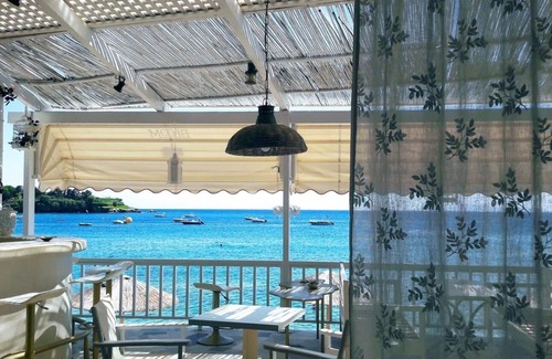 Agia Pelagia House | By the Sea beachfront luxury apartment with a large patio