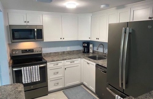 Marathon Condo | BYOB -boat-Completely renovated, private ramp, boat slip, heated pool and more!