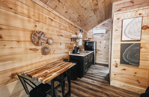 Hartwell Apartment | Cabin #1: Studio style layout with kitchenette and a large gravel parking pad beside the cabin for easy boat or trailer storage.