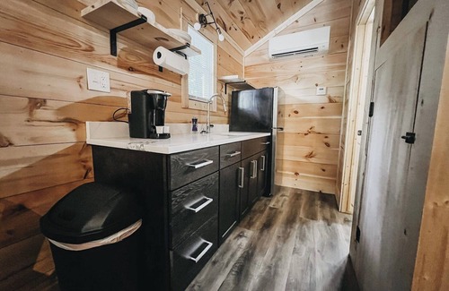 Hartwell RV Rental | Cabin #6: Studio style layout with kitchenette and a large gravel parking pad beside the cabin for easy boat or trailer storage.