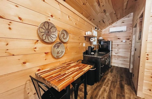 Hartwell RV Rental | Cabin #6: Studio style layout with kitchenette and a large gravel parking pad beside the cabin for easy boat or trailer storage.