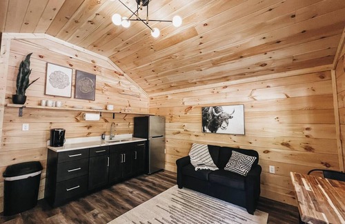 Hartwell RV Rental | Cabin #7: One king-size bed, a kitchenette, and a large gravel parking pad beside the cabin for easy boat or trailer storage.