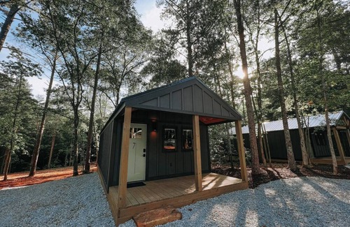 Hartwell RV Rental | Cabin #7: One king-size bed, a kitchenette, and a large gravel parking pad beside the cabin for easy boat or trailer storage.