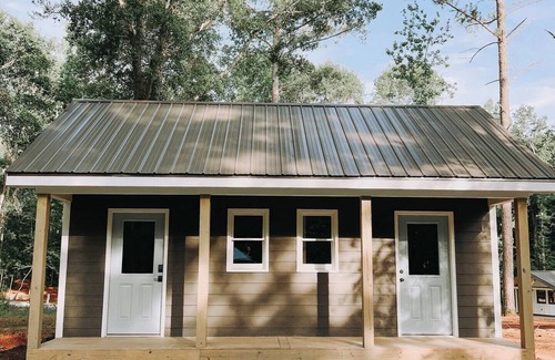 Hartwell RV Rental | Cabin #7: One king-size bed, a kitchenette, and a large gravel parking pad beside the cabin for easy boat or trailer storage.