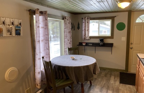 Eagle River Cottage | Cabin on the Eagle River Chain! Boat dock slip! Kayaks! Firewood for bonfires!