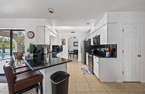 Port Charlotte House | CANAL HOME! WARM PRIVATE POOL! FAMILY MEMORIES! WIFI! GRILL! BABY SUPPLIES!