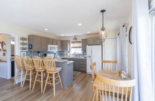 Colington Harbour House | Canalfront home w/wraparound decks and community amenities!