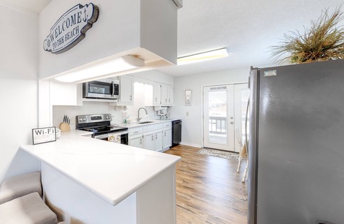 Royal Lagoons House | Canalside home with room for a boat - short walk from the beach