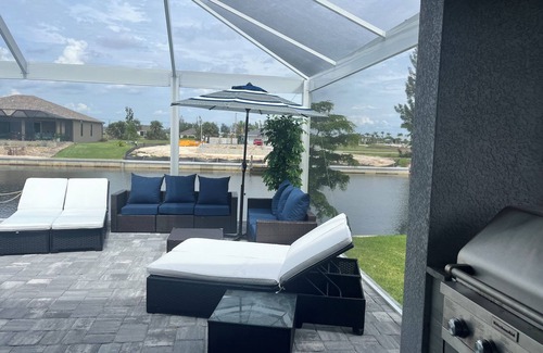 Burnt Store House | Cape Coral cozy! Pool, hot tub, outdoor kitchen, gulf access, fishing,sleeps 10
