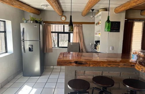 Creel Cabin | Casa MiRó Creel, a cozy place with an indoor fireplace.