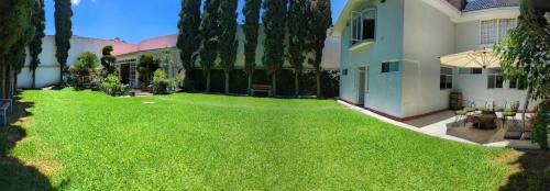 Puebla House | Casa O - Tu Hogar Boutique en Puebla con 6 Recámaras y Terraza Privada