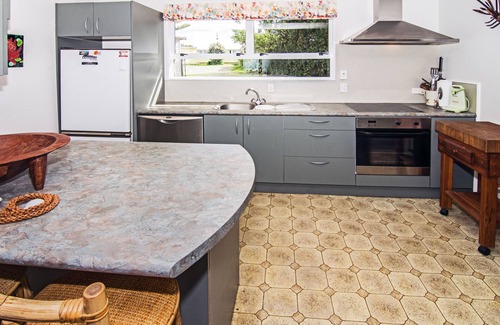 Castlepoint House | Castlepoint - Private family beach home with stunning views capturing the sun.