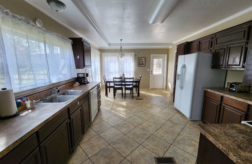 Tyler House | Cattlemens Quarters beautiful ranch setting with fenced yards and a great deck!
