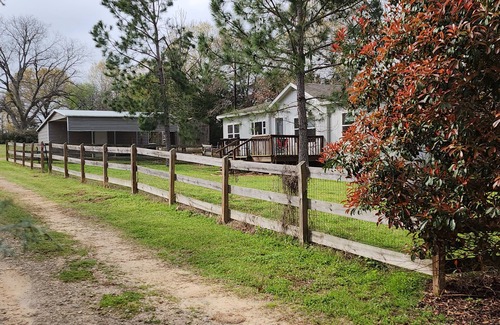Tyler House | Cattlemens Quarters beautiful ranch setting with fenced yards and a great deck!