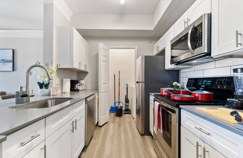 Far North Dallas Apartment | Central Ritzy Getaway with King Bed, Free Parking and Drinking Water Provided.