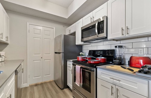 Far North Dallas Apartment | Central Ritzy Getaway with King Bed, Free Parking and Drinking Water Provided.