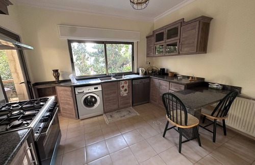 Amman Apartment | Centrally Located Bright 2 BR Apartment with Breathtaking Tropical Tree Garden!