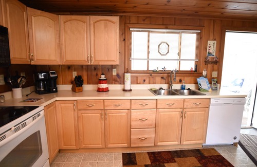 Prudenville Cottage | Centrally located, four season retreat w/firepit and lakeview.