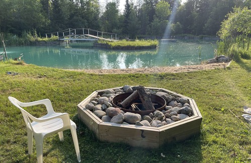 Fife Lake Ski Chalet | Chalet on Manistee River with amazing backyard pond. 5 minutes from Fife Lake.