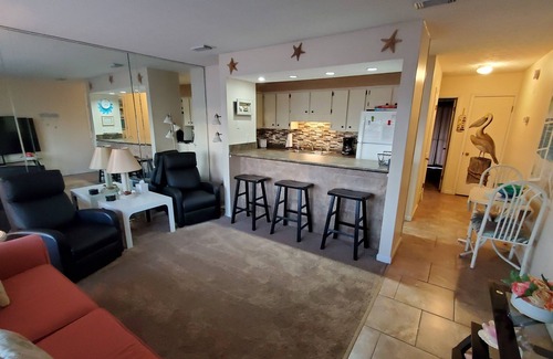 Holiday Beach Condo | Charming 1Br Condo on the beach with pool outside back door and beach access.