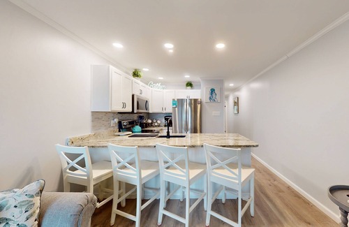 Caine Woods Condo | Charming 1st-floor condo w/community pool & furnished patio - walk to the beach