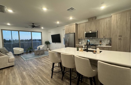 Clovis House | Charming 2-bedroom townhome with garage, pool access, & all utilities included.