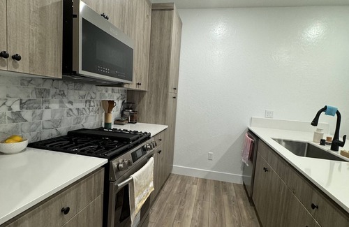 Clovis House | Charming 2-bedroom townhome with garage, pool access, & all utilities included.
