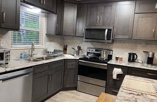 Edgewater House | Charming 3 bedroom 2 bath home w/wraparound veranda on one acre of land.