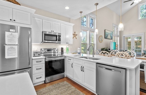 Laurel Grove House | Charming Beach Cottage w/2 GOLF CARTS! Pool, Hot Tub, Beach Tram, Near Wharf